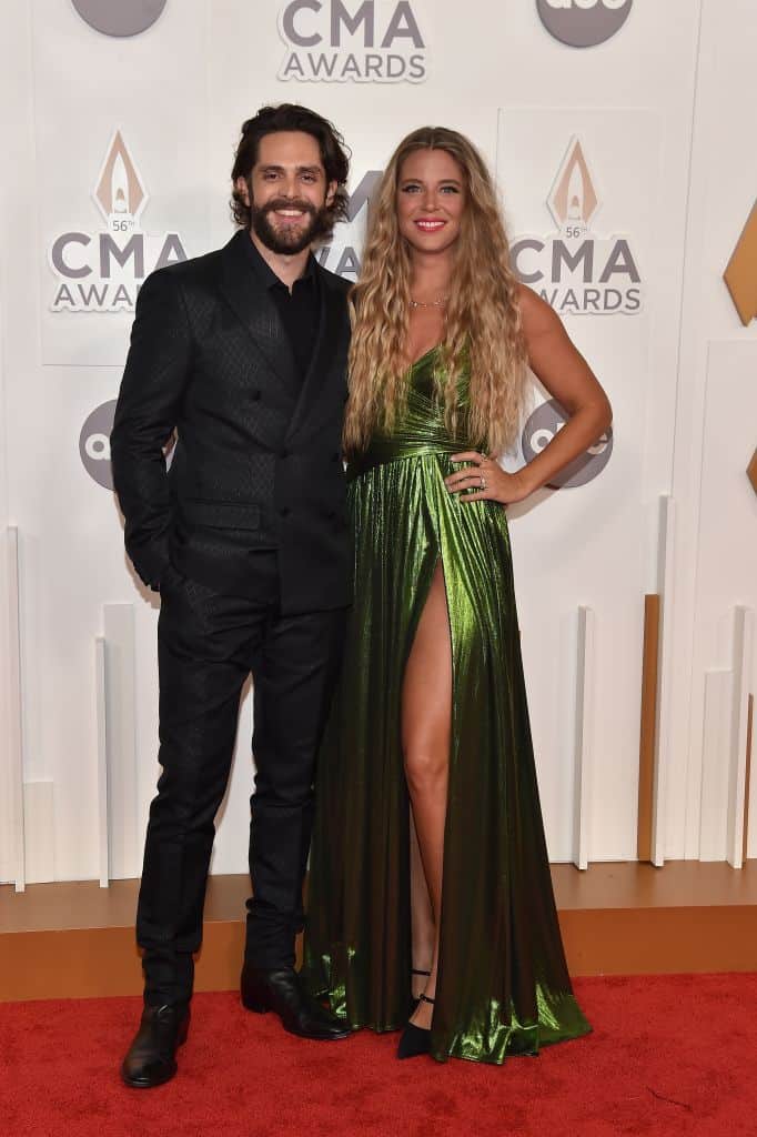 Carrie Underwood is joined by husband Mike Fisher on the red carpet at the  CMA Awards, where she will be participating in three separate