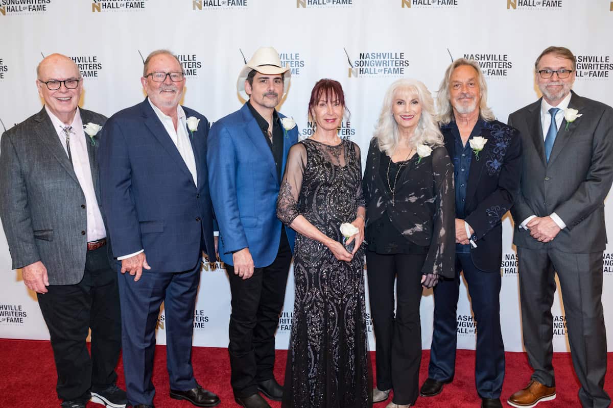 Nashville Songwriters Hall of Fame Class of 2025: Don Cook, Steve Bogard, Brad Paisley, JJ Cale's wife, Christine Lakeland - Cale, Emmylou Harris, Jim Lauderdale, Tony Martin; Photo by Andrew Wendowski