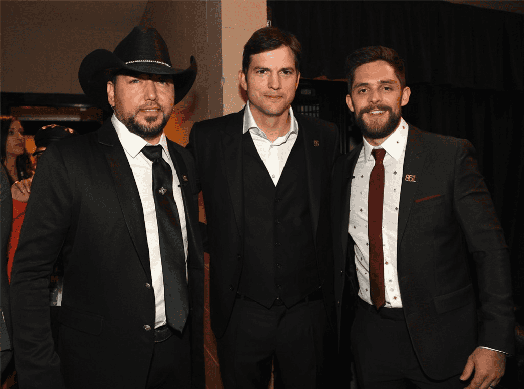 Jason Aldean, Ashton Kutcher, Thomas Rhett; Photo by Getty Images for ACM