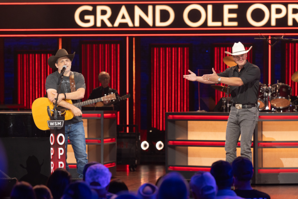 Opry member and friend Jon Pardi invites Rhett Akins to become a member of the Opry family. Photos credit: © Grand Ole Opry, photos by Chris Hollo