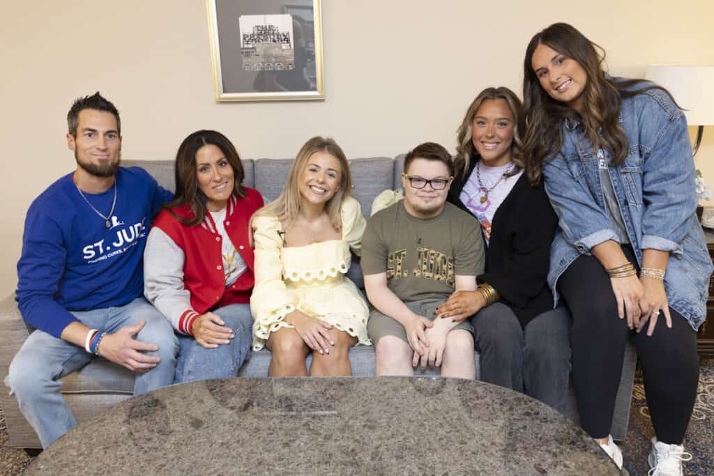 Anne Wilson with St. Jude patient Sawyer + family; Photo by ALSAC + St. Jude Children’s Research Hospital
