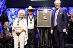 Tanya Tucker, Paul Overstreet and Museum CEO, Kyle Young; Photo by Jason Kempin/Getty Images for Country Music Hall of Fame and Museum